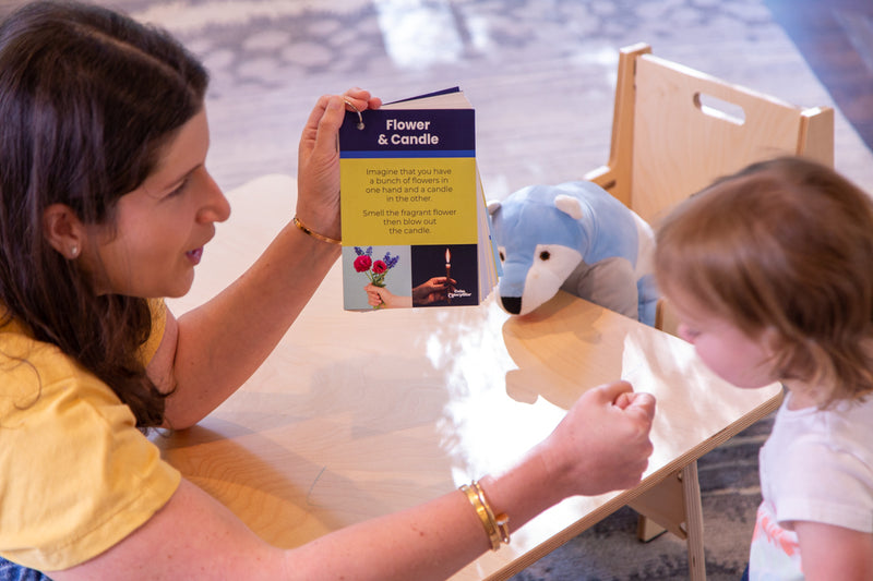 Image showing Calm Caterpillar's feelings & emotions flashcards for kids. The flower & candle technique is displayed, which is a breathing technique where the child imagines they have flowers in one hand and a candle in the other.