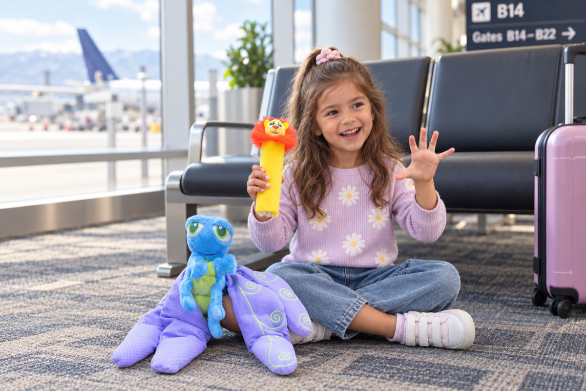A girl sitting cross-legged on an airport gate floor, waving, holding Rory the breathing stick, with Flutter beside her.
