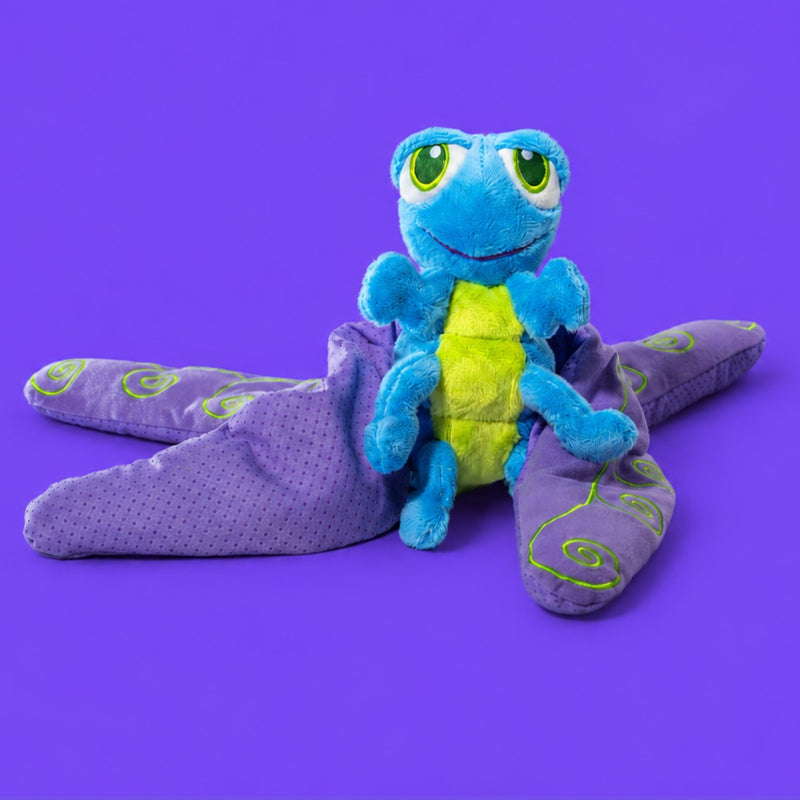 Flutter the Dragonfly, a blue and green plush with weighted purple wings spread flat.