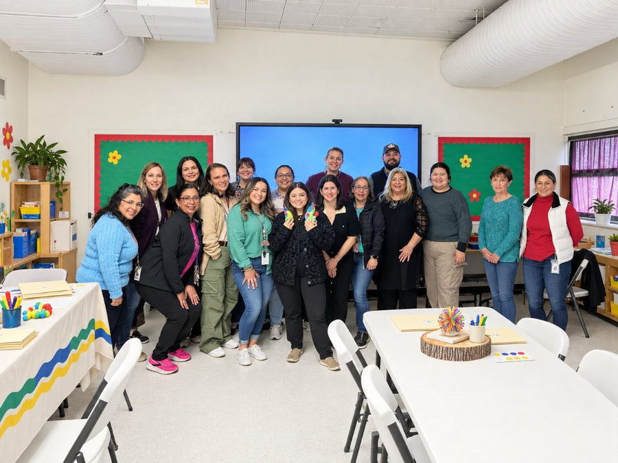 A school staff team gathered in a training room after a Calm Caterpillar professional development session.