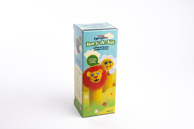 The Rory Junior box, printed with a lion and a daisy in a grass field