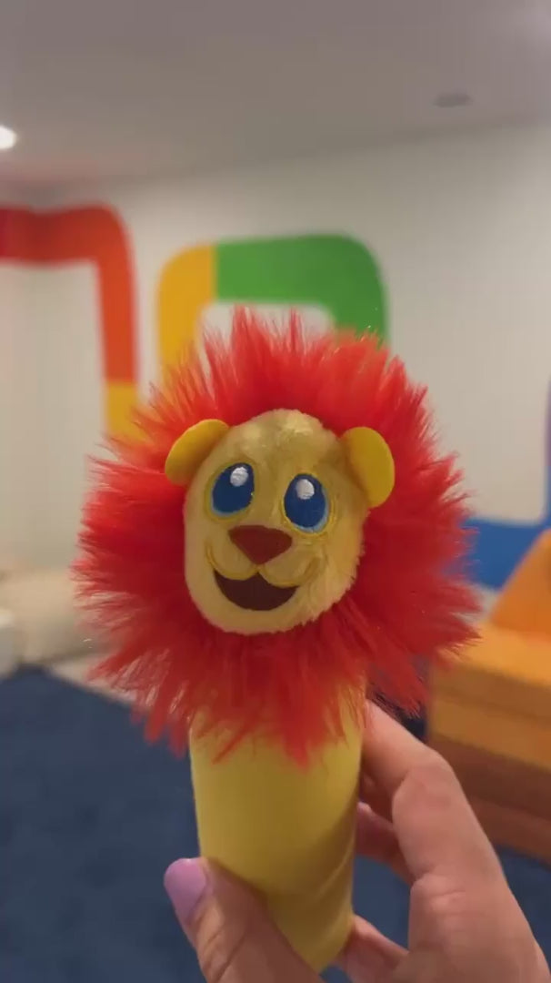 An adult flipping Rory Junior between the flower end and the lion end