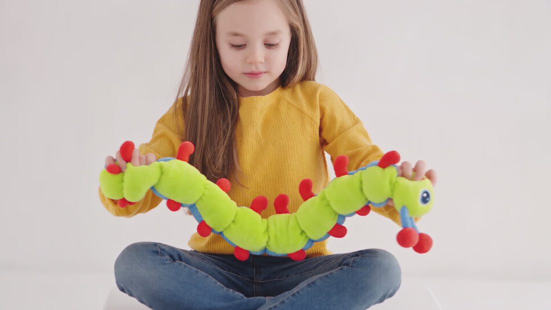 A child stretching, counting and draping Calmee the Caterpillar at home